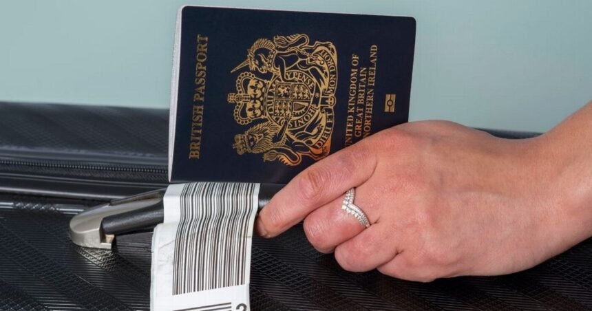 0_New-dark-blue-colored-British-passport-held-in-a-travellers-hand-with-holiday-suitcase.jpg